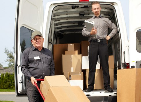 Man with van loading boxes in Palmers Green