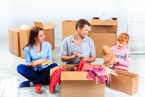 Packed boxes and furniture prepared for a removals job