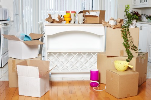Moving team handling boxes and furniture at a local property