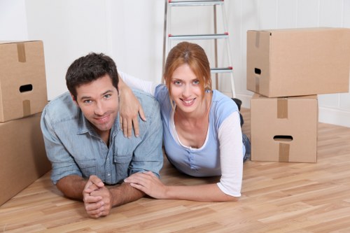 Residential removals team handling household items near Palmers Green