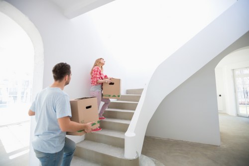 Professional movers handling household furniture in Palmers Green