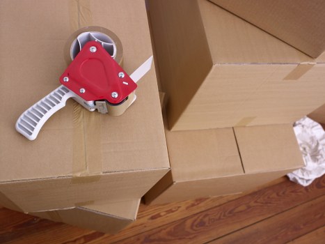 Insured man with van service handling furniture carefully in a residential area