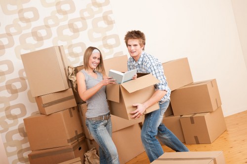 Furniture being carried down stairs in a Palmers Green property