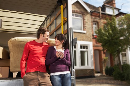 Local movers preparing fragile household items for transport in Palmers Green