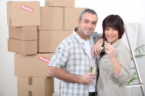Packed moving boxes and furniture in a North London home